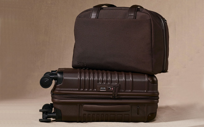 A Bag on top of a Suitcase