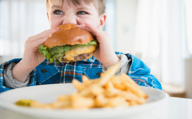 A Child Eating a Burger A Child Eating a Burger