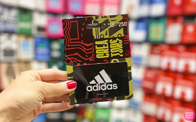A Person Holding Adidas Gift Card