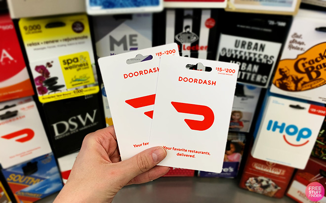 A Person Holding DoorDash Gift Cards