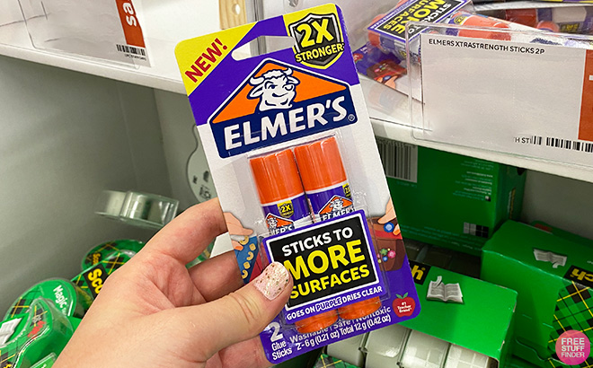 A Person Holding Elmers Extra Strength Washable Glue Sticks