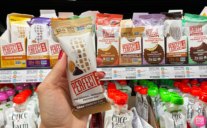 A Person Holding Perfect Bar Dark Chocolate Peanut Butter