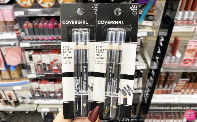 A Person Holding Two CoverGirl Brow Eyemakers Eyeliners
