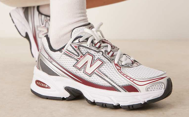 A Person wearing New Balance 740 Mens Shoes in Red Color