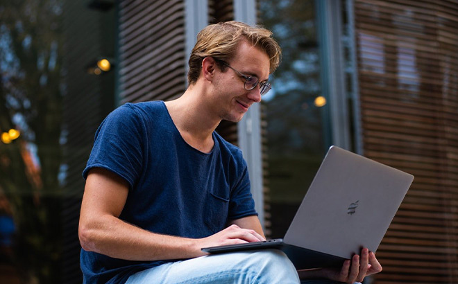 A Person Working on a Laptop A Person Working on a Laptop