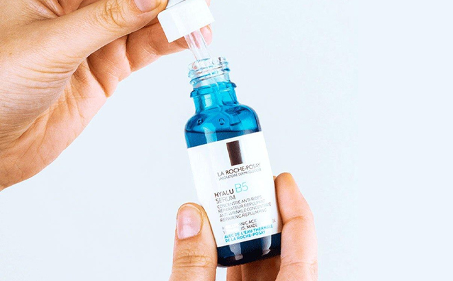A Woman Holding La Roche Posay Hyalu B5 Pure Hyaluronic Acid Serum A Woman Holding La Roche Posay Hyalu B5 Pure Hyaluronic Acid Serum