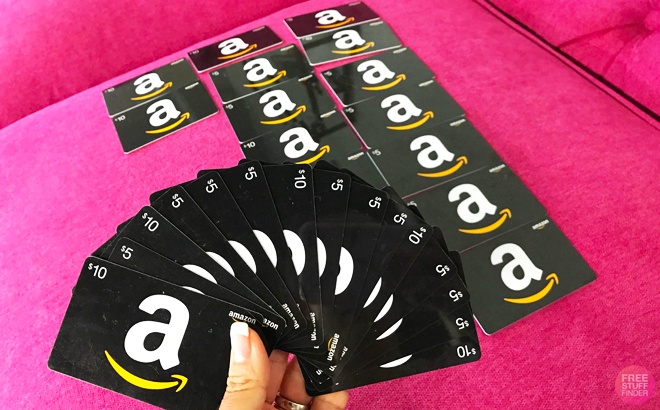 A Hand Holding Amazon Gift Cards