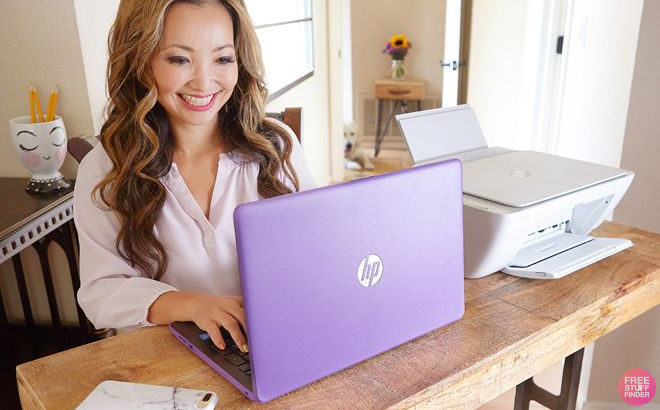 Woman Typing on a Purple HP Laptop Woman Typing on a Purple HP Laptop