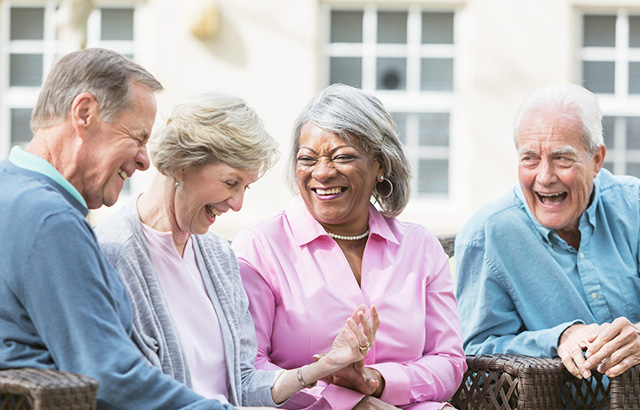 Four Senior Citizens Hanging Out and Laughing