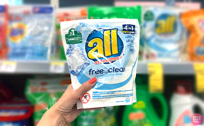 Hand holding All Free and Clear Mighty Pacs Laundry Detergent 19 Counts Hand holding All Free and Clear Mighty Pacs Laundry Detergent 19 Counts