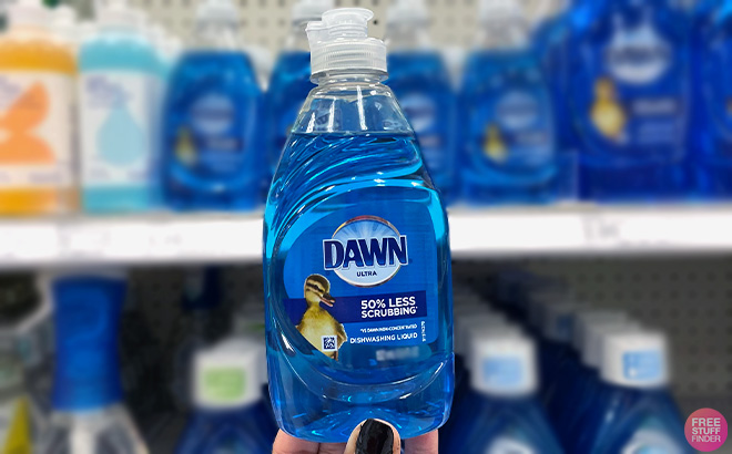 Hand holding Dawn Ultra Dishwashing Liquid Dish Soap Hand holding Dawn Ultra Dishwashing Liquid Dish Soap
