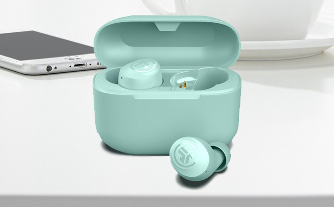 JLab Go Air Pop True Wireless Earbuds in Mint Green Color on the Table