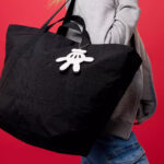 Person Wearing Disney Tote and Pouch