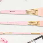 Too Faced 3 piece Makeup Brush Set on a Table
